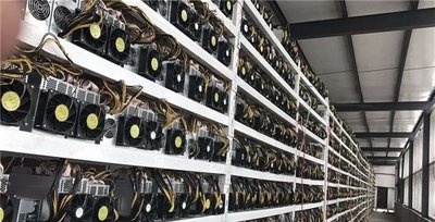 A large-scale cryptocurrency mining farm combining BTC, ETH, and DOG rigs